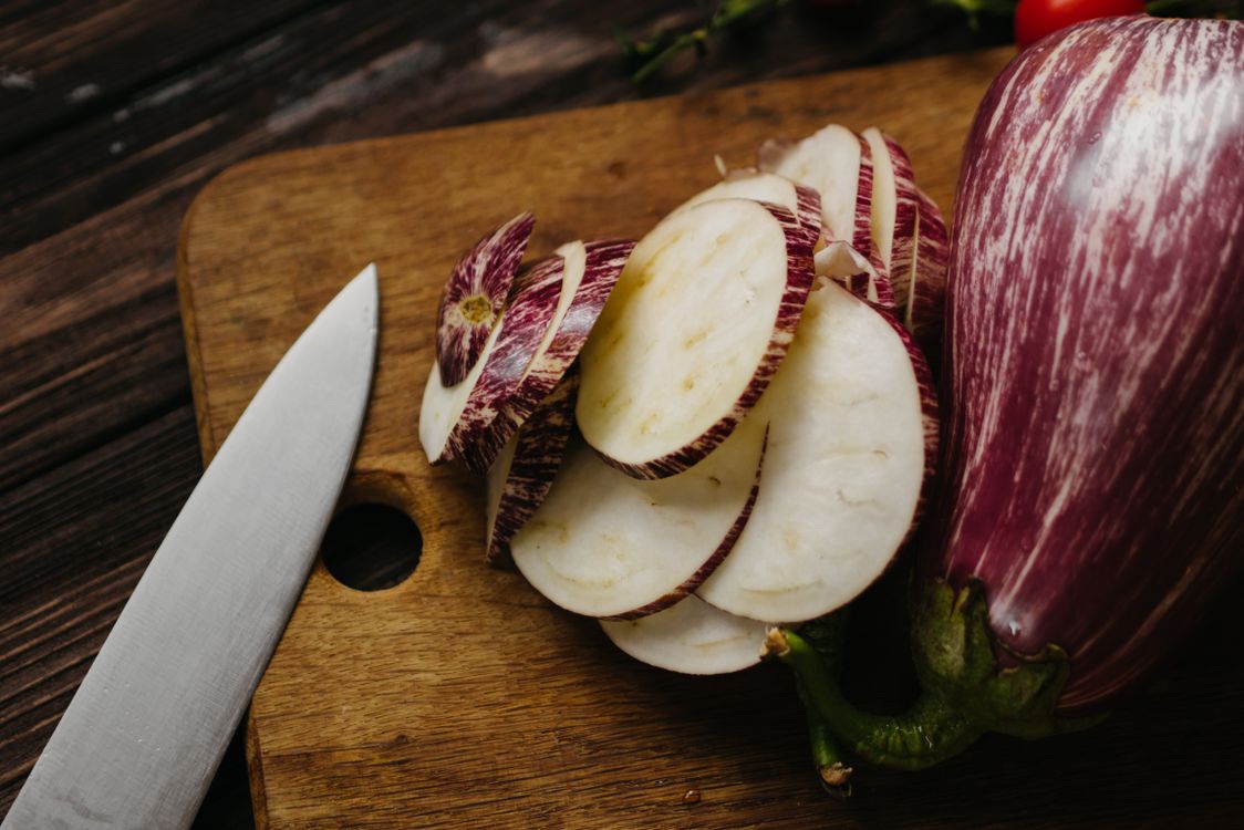 sliced eggplant on a wooden cutting board