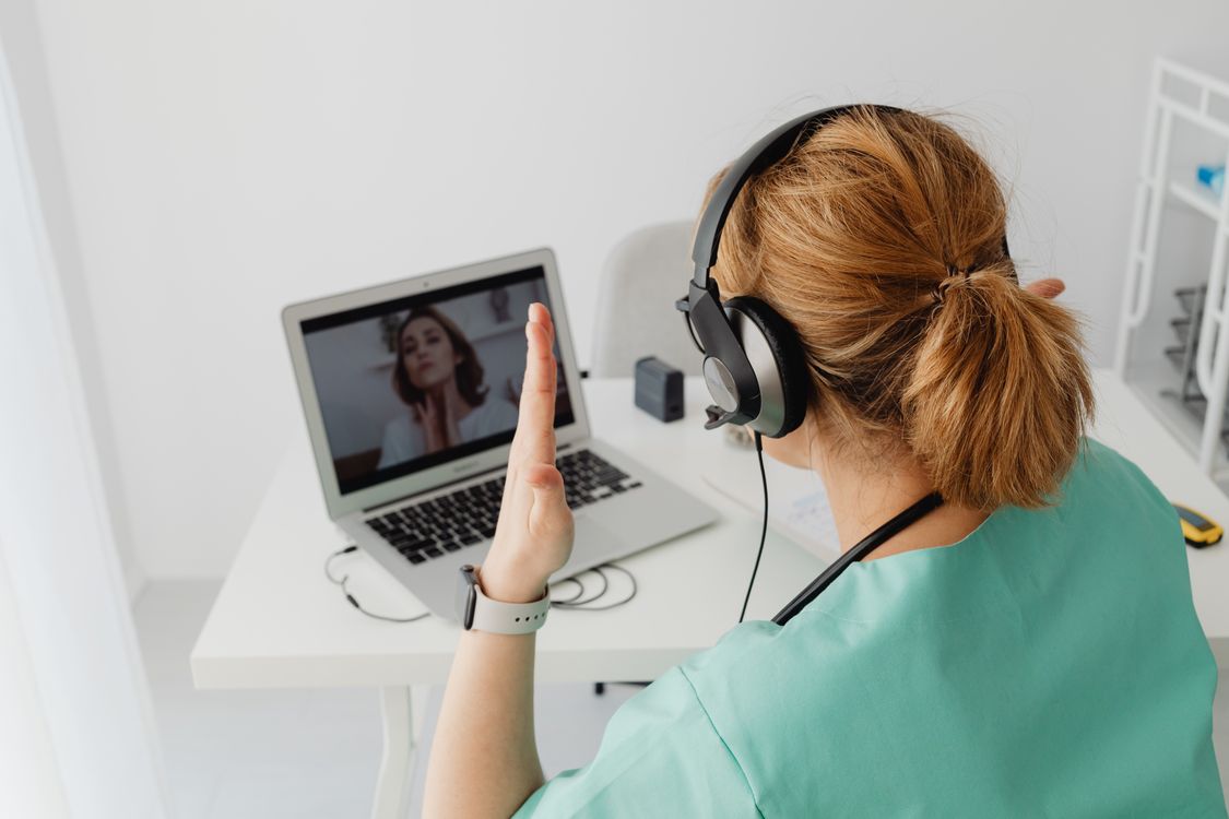 doctor on a laptop screen during a video consultation